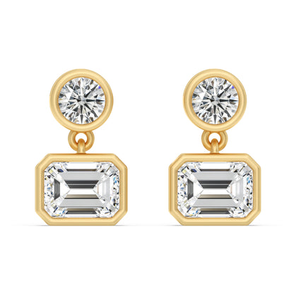 SOHO DROP EARRING, BRILLIANT CUT DIAMOND WITH A EMERALD CUT DROP DIAMOND SET IN 14K GOLD.