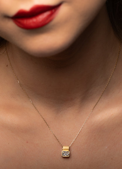 DIAMOND FETISH SOHO PENDANT, RADIANT CUT DIAMOND SET IN 14K GOLD.